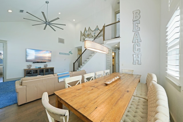 dining space featuring plenty of natural light, high vaulted ceiling, dark hardwood / wood-style flooring, and ceiling fan