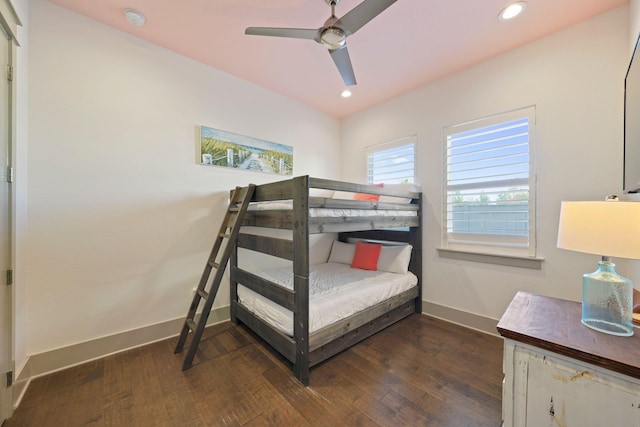 bedroom with ceiling fan and dark hardwood / wood-style flooring