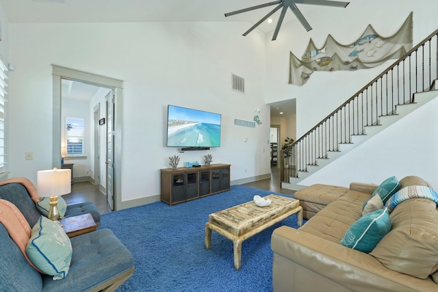 living room with high vaulted ceiling and ceiling fan