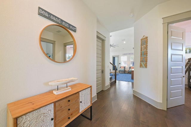 hallway with dark wood-type flooring