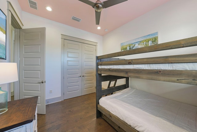 bedroom with ceiling fan, a closet, and dark hardwood / wood-style floors