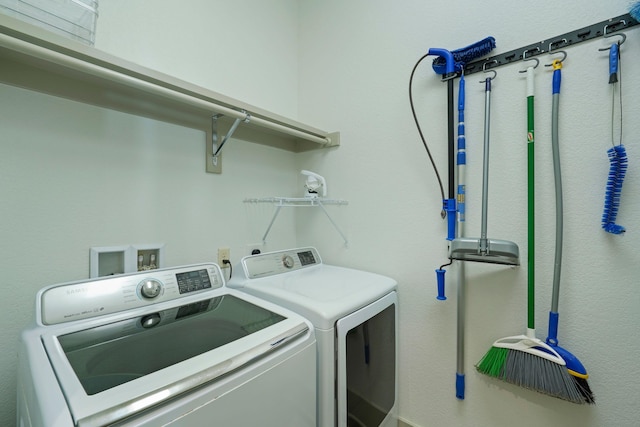 washroom featuring washer and dryer