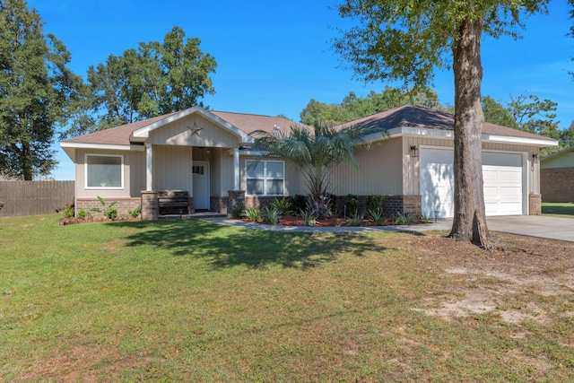 view of front of house featuring a front lawn and a garage