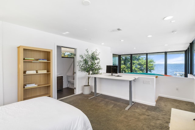 bedroom with dark colored carpet