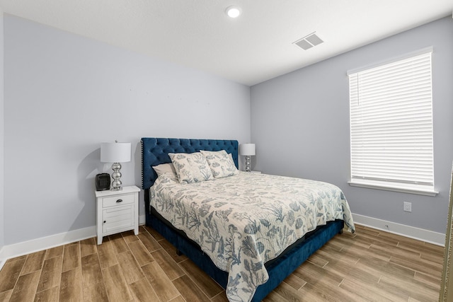 bedroom featuring light hardwood / wood-style floors