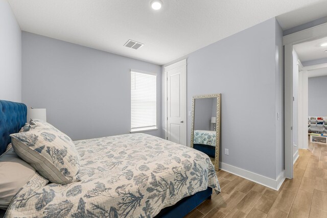 bedroom featuring wood-type flooring