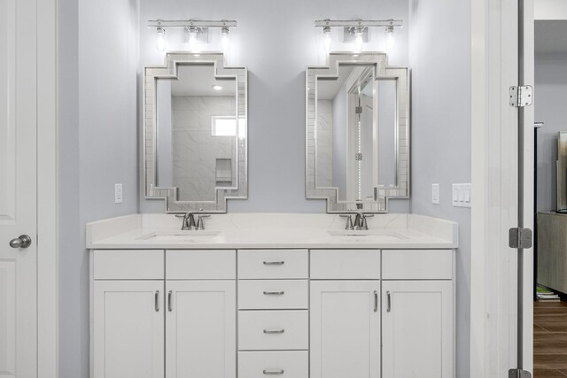 bathroom featuring vanity and hardwood / wood-style flooring