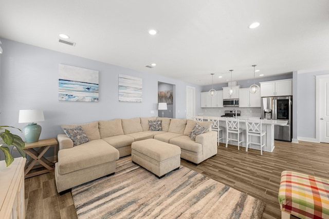 living room with hardwood / wood-style flooring