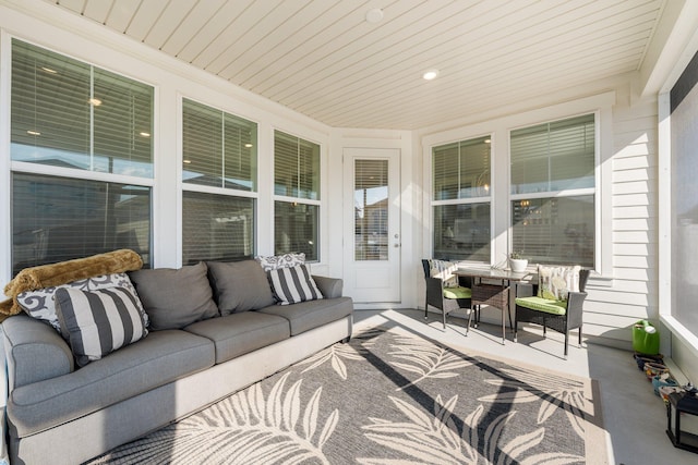 sunroom featuring wood ceiling