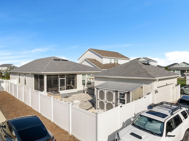 view of front of property with a sunroom