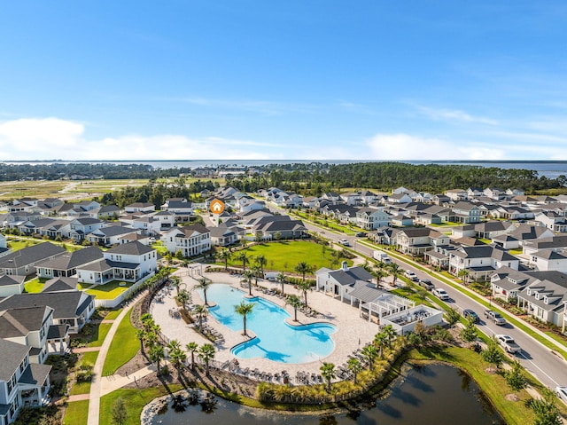 birds eye view of property with a water view