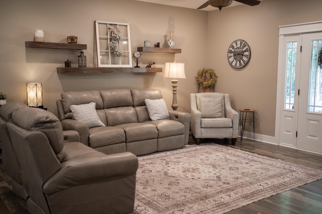 living room featuring dark hardwood / wood-style floors and ceiling fan