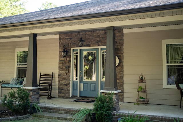 doorway to property with a porch