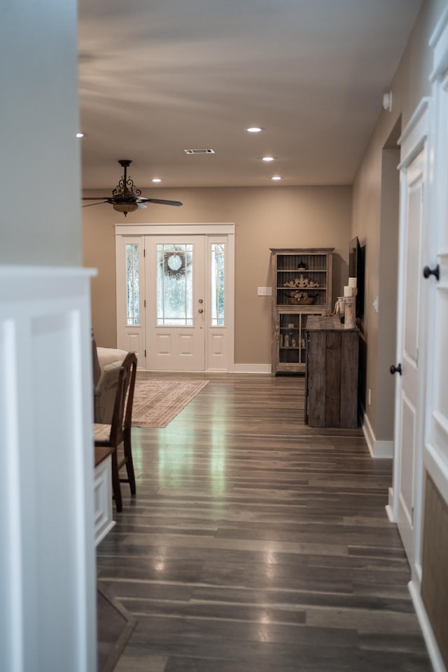 foyer with dark hardwood / wood-style floors and ceiling fan