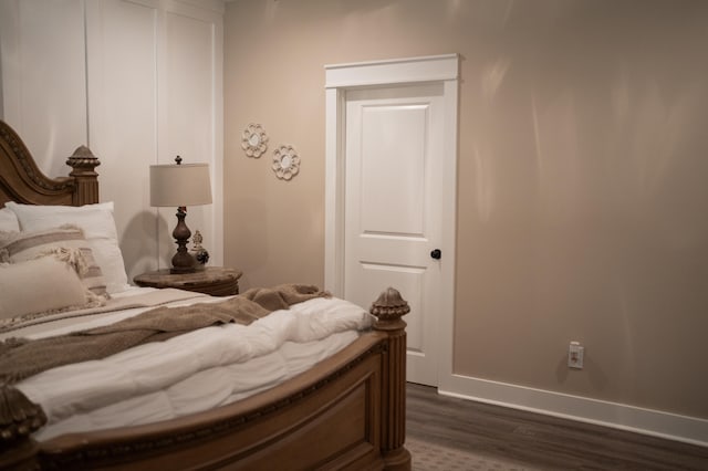 bedroom featuring dark wood-type flooring