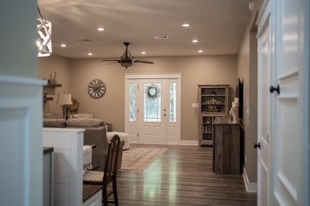 foyer entrance featuring ceiling fan and dark hardwood / wood-style flooring