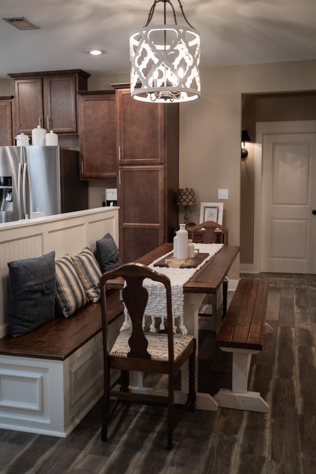 dining space featuring dark hardwood / wood-style floors