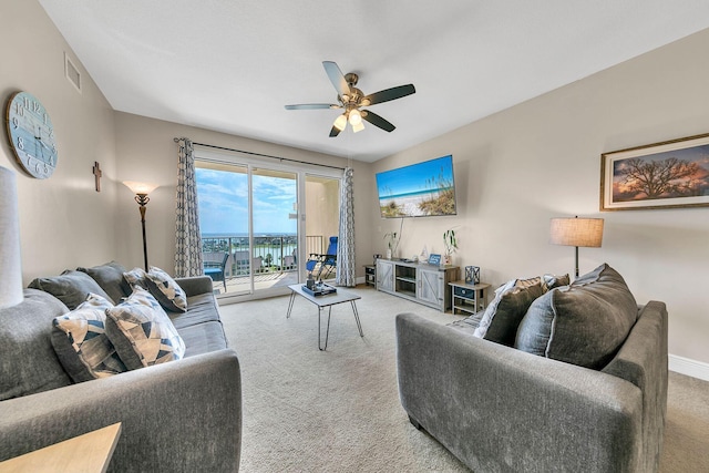 carpeted living room featuring ceiling fan