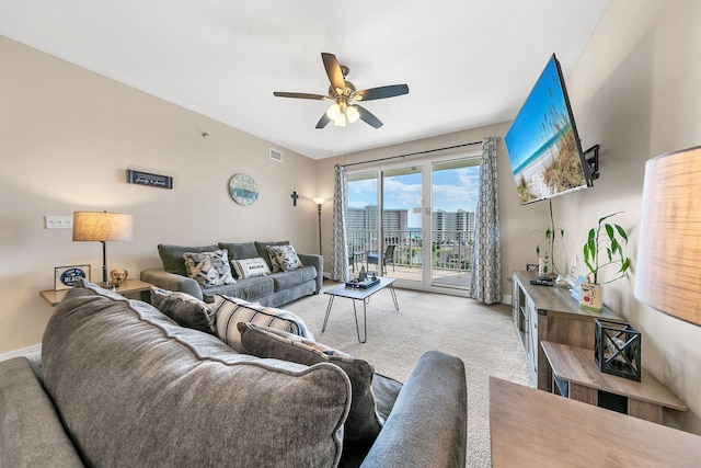 living room with light carpet and ceiling fan