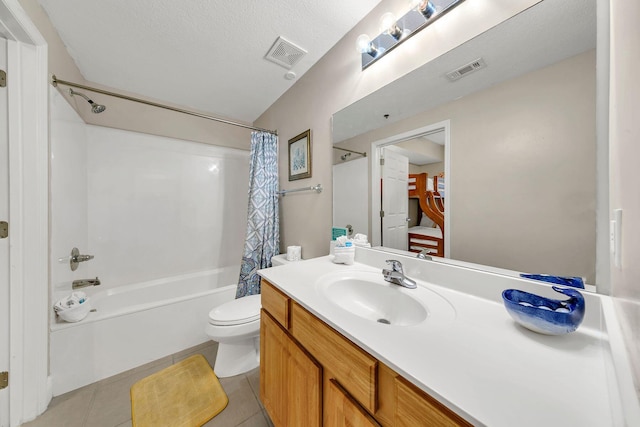 full bathroom featuring vanity, shower / bath combo, a textured ceiling, tile patterned floors, and toilet