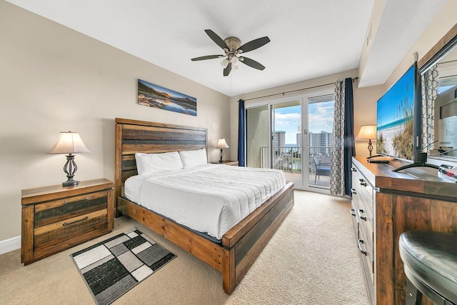 bedroom with light carpet, access to exterior, and ceiling fan