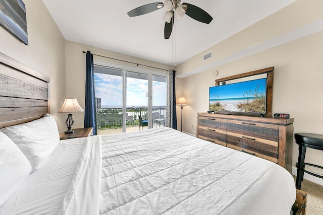 carpeted bedroom featuring ceiling fan, vaulted ceiling, and access to outside