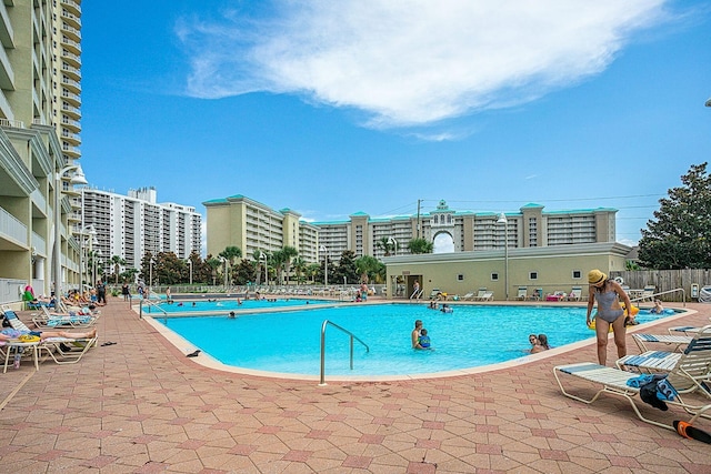 view of swimming pool with a patio area