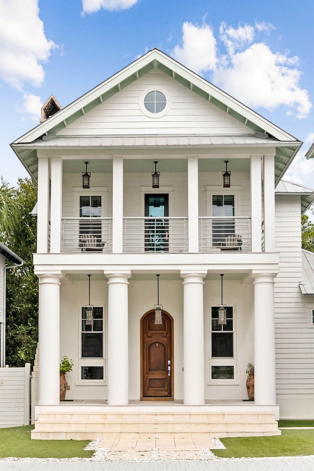 view of front facade with a porch and a balcony