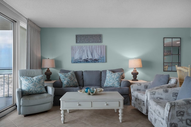 tiled living room featuring a baseboard radiator and a textured ceiling