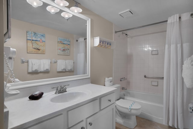 full bathroom with tile patterned flooring, shower / bathtub combination with curtain, vanity, and toilet