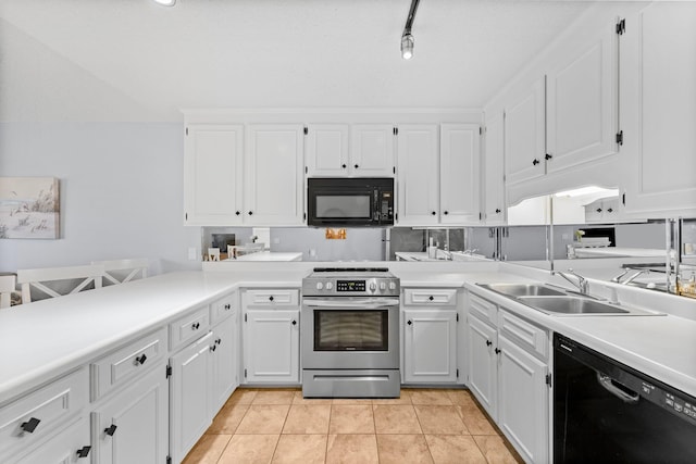 kitchen featuring light countertops, white cabinets, black appliances, a sink, and light tile patterned flooring