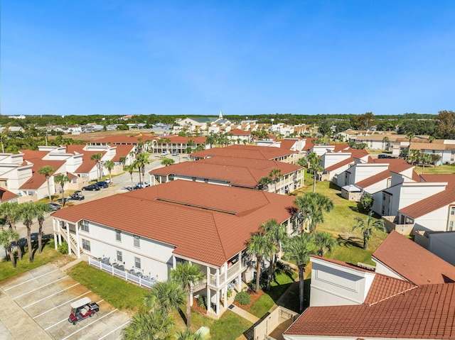 birds eye view of property with a residential view