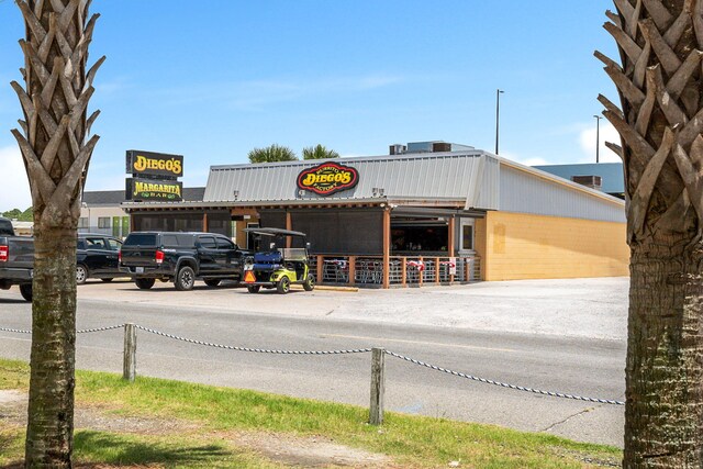 view of property with uncovered parking