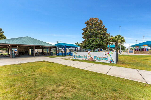view of property's community featuring a lawn and a gazebo