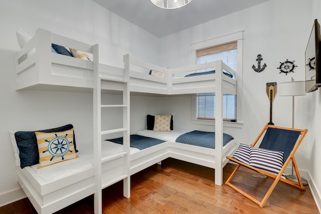 bedroom with hardwood / wood-style floors