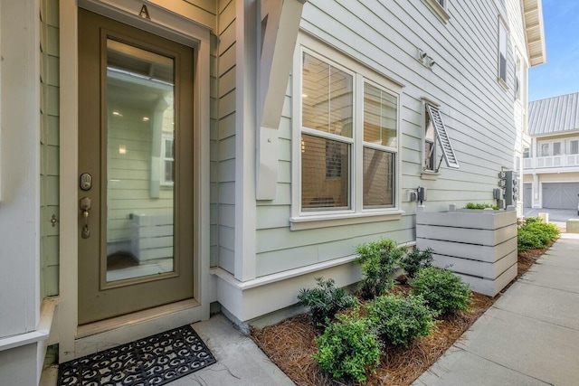 doorway to property featuring a garage