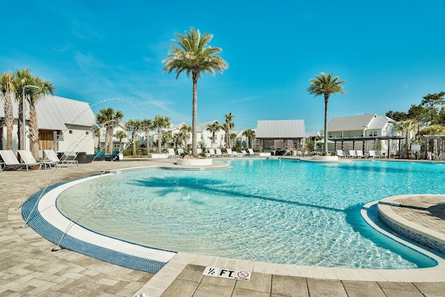 view of swimming pool featuring a patio area