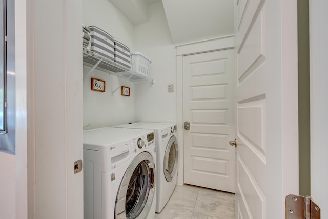 laundry area featuring washing machine and clothes dryer