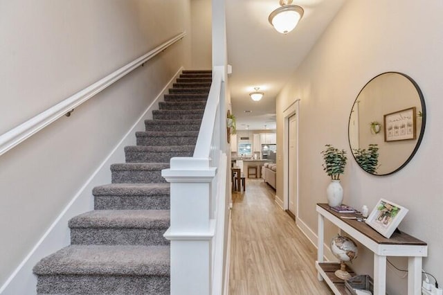 staircase featuring hardwood / wood-style flooring