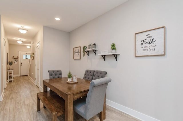 dining area with light hardwood / wood-style floors