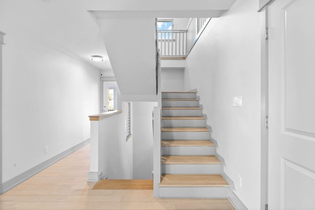 staircase featuring hardwood / wood-style floors