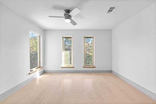 unfurnished room with ceiling fan and light hardwood / wood-style flooring