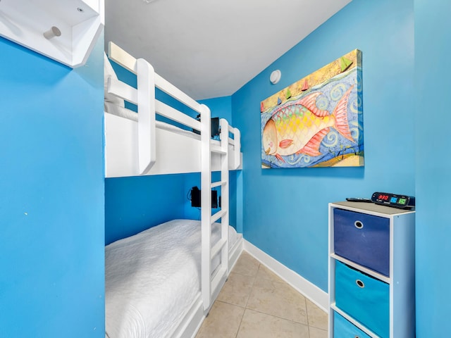 bedroom with light tile patterned flooring
