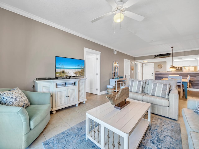 tiled living room with crown molding and ceiling fan