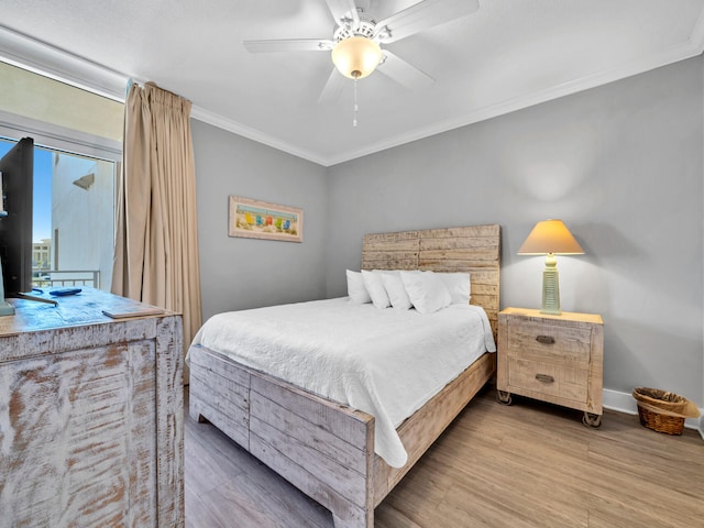 bedroom featuring ornamental molding, hardwood / wood-style floors, and ceiling fan