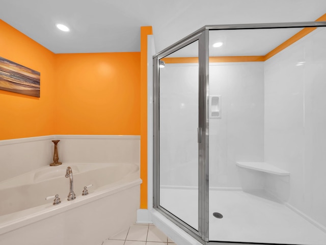bathroom featuring tile patterned floors and plus walk in shower