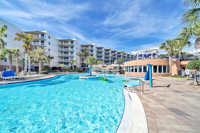 view of swimming pool featuring pool water feature