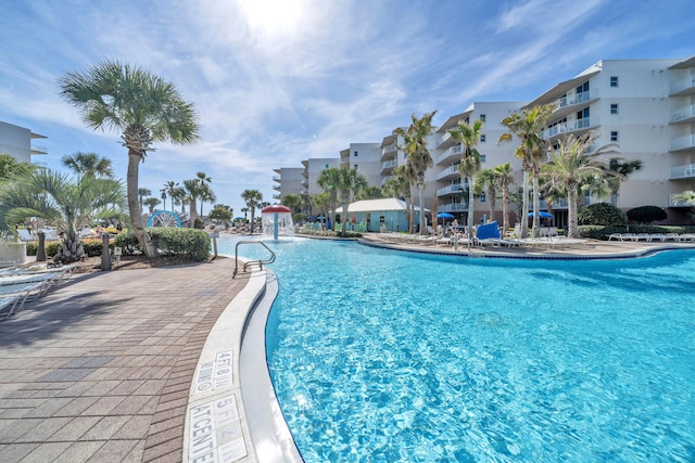 view of swimming pool featuring pool water feature