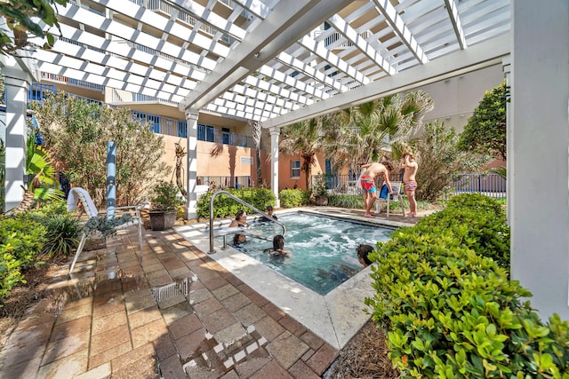 view of swimming pool featuring a pergola and a patio area