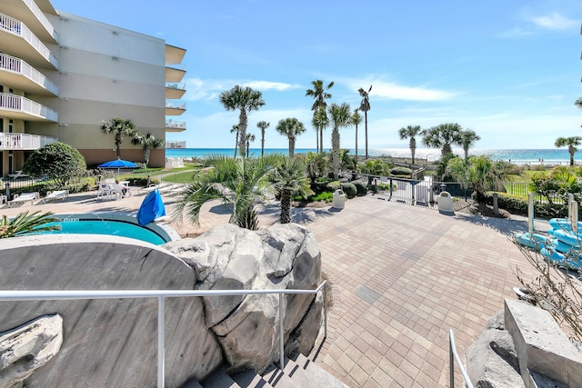 view of swimming pool with a water view